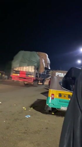 Night scenes from Bukuru: loading, lounging, and card games