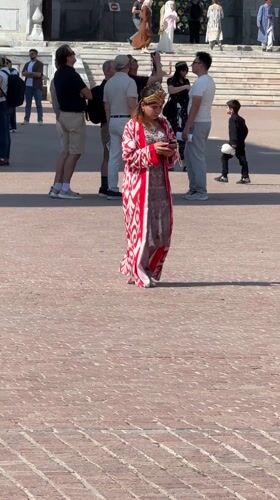 Traditional life continues at historic Samarkand madrasah plaza
