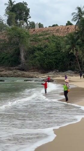 Early morning surf fishing scene captured at Thai beach