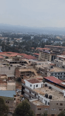 Musanze, Rwanda: street life and construction under mountain skies
