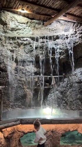 Visitor explores grotto-themed venue with waterfalls, carousel in Podgorica