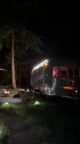 Illuminated Airstream trailer spotted in Bowen Island woods