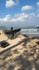 Busy morning surf session at Kuta Beach, Bali