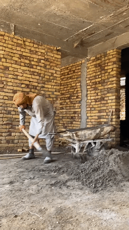 Cement work underway inside an unfinished Kandahar building