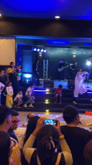 Late-night musical performance features dancing children in Valencia