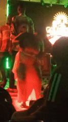 Woman performs dance on stage at nightclub venue