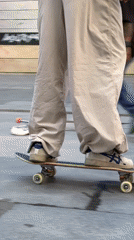 Skateboarders perform tricks in Barcelona plaza