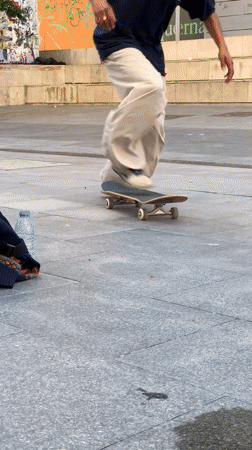 Skateboarders perform tricks in Barcelona plaza