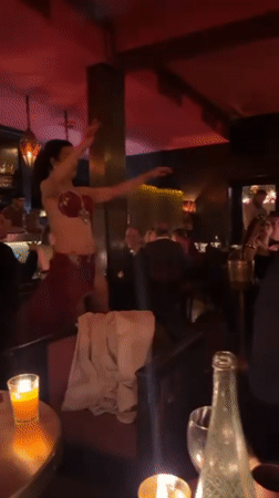 Belly dancer entertains diners at Marrakech restaurant evening