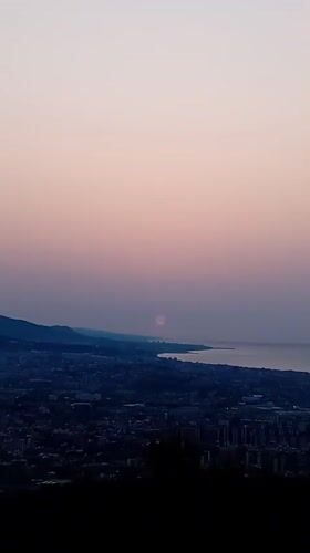 Barcelona at sunset, viewed from above the city