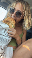 Quick bread snack in a parked car, Nigavan, Armenia
