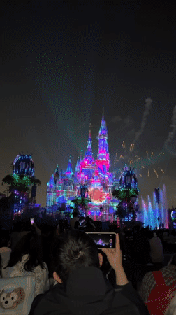 Crowds gather for light show at Shanghai Disneyland castle