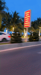 Evening coastal scene captured in Nha Trang with illuminated palms