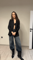 Woman showcases casual-chic outfit in Stara Zagora fashion display