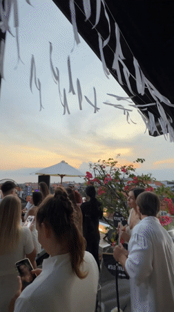 Rooftop sunset party and food moments in Bali