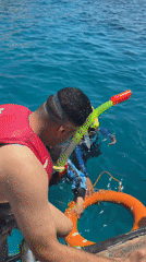 Woman takes selfies during Red Sea boat trip, Egypt