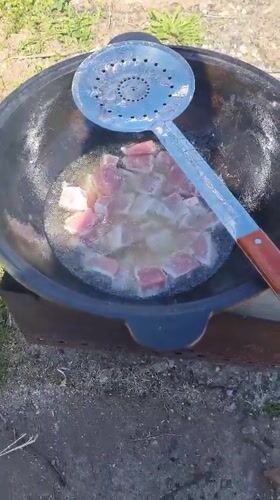 Traditional outdoor cooking documented in Rusalevka, Russia