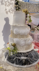 Wedding celebration with decorated cake captured in Bukuru, Nigeria