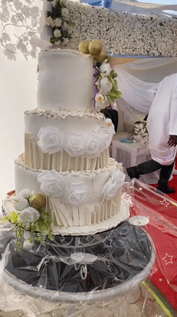 Wedding celebration with decorated cake captured in Bukuru, Nigeria