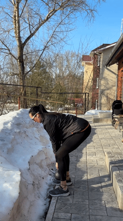Woman documents outdoor kettlebell workout session in Chaikovsky