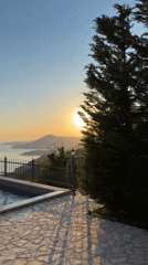 Sunrise captured over Montenegro coastal landscape with pool area