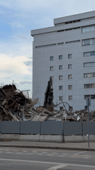 Excavator demolishes building in Moscow construction site
