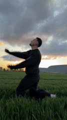 Man performs umbrella backflips in Bulgarian field