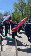 Navy-uniformed group gathers in Ufa park on sunny day
