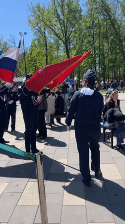 Navy-uniformed group gathers in Ufa park on sunny day