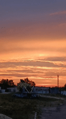 Striking summer sunset spreads across industrial Svietlahorsk, Belarus