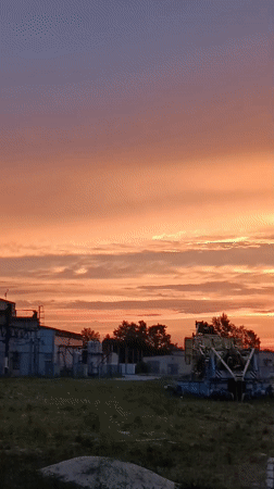 Striking summer sunset spreads across industrial Svietlahorsk, Belarus
