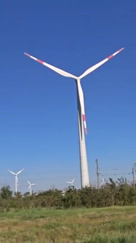 Wind turbines operating under clear skies in Zimovniki, Russia