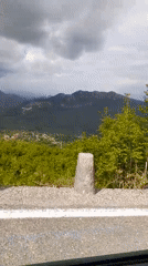Roadside video captures mountain valley landscape with settlements
