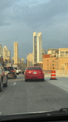 Late night traffic flows slowly through downtown Chicago streets