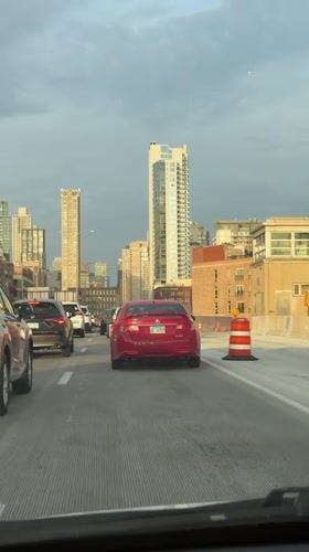 Late night traffic flows slowly through downtown Chicago streets