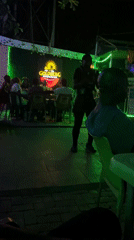 Evening social gathering at outdoor bar in Nyanya, Nigeria
