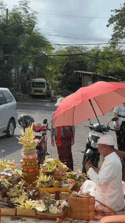 Traditional religious ceremony with offerings documented in Kuta Selatan
