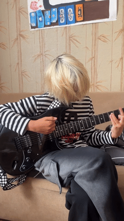 Guitar practice in Togliatti with a Sphynx cat in attendance