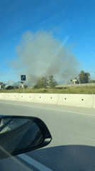 Heavy smoke rising near construction infrastructure in Surrey, BC