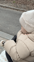 Family outing documented on Klin sidewalks during spring afternoon