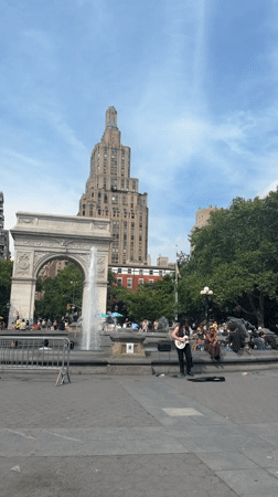 Washington Square Park buzzes on a sunny June afternoon