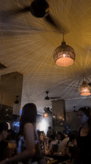 Young adults socialize at busy North Kuta bar