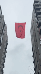 Turkish flag displayed between apartment buildings in Esenyurt documented