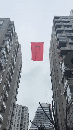 Turkish flag displayed between apartment buildings in Esenyurt documented