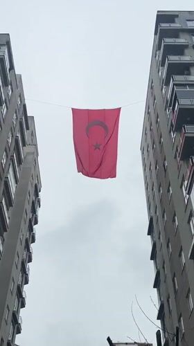 Turkish flag displayed between apartment buildings in Esenyurt documented