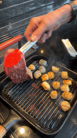 Home cook prepares seafood dinner in Wealden kitchen