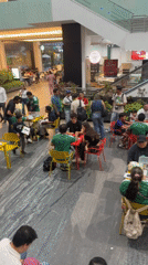 Late-night gathering in Puebla mall features green-shirted participants