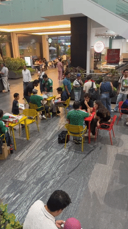 Late-night gathering in Puebla mall features green-shirted participants