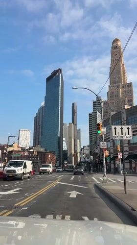 Driving through a Brooklyn street on a summer afternoon