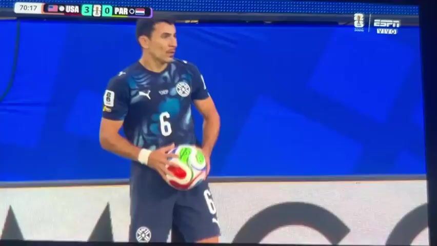 The video shows a soccer match, with the score displayed as USA 3, PAR 0. A player in a dark blue and black jersey with the number 6 on it is holding a soccer ball. The crowd is visible in the background, and the stadium appears to be filled. The match is taking place on a green grass field, with white lines marking the boundaries. There are advertisements on the walls surrounding the field, including "FIFA WORLD CUP 2026", "THE HOME DEPOT DELIVERS", "QATAR AIRWAYS", and "CASAMIGOS". The game is being broadcast on ESPN.